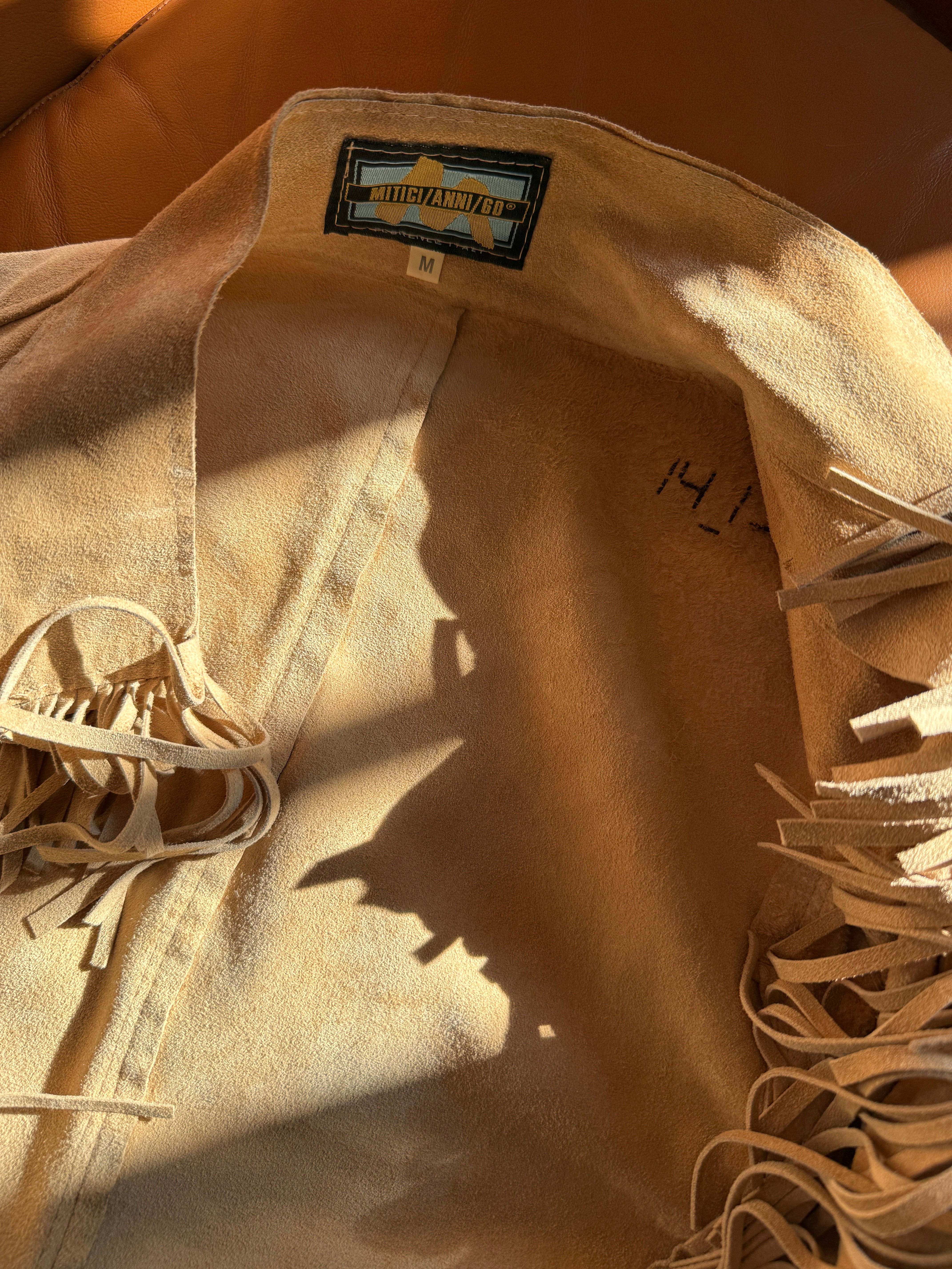 Giacca vintage in pelle con frange beige western