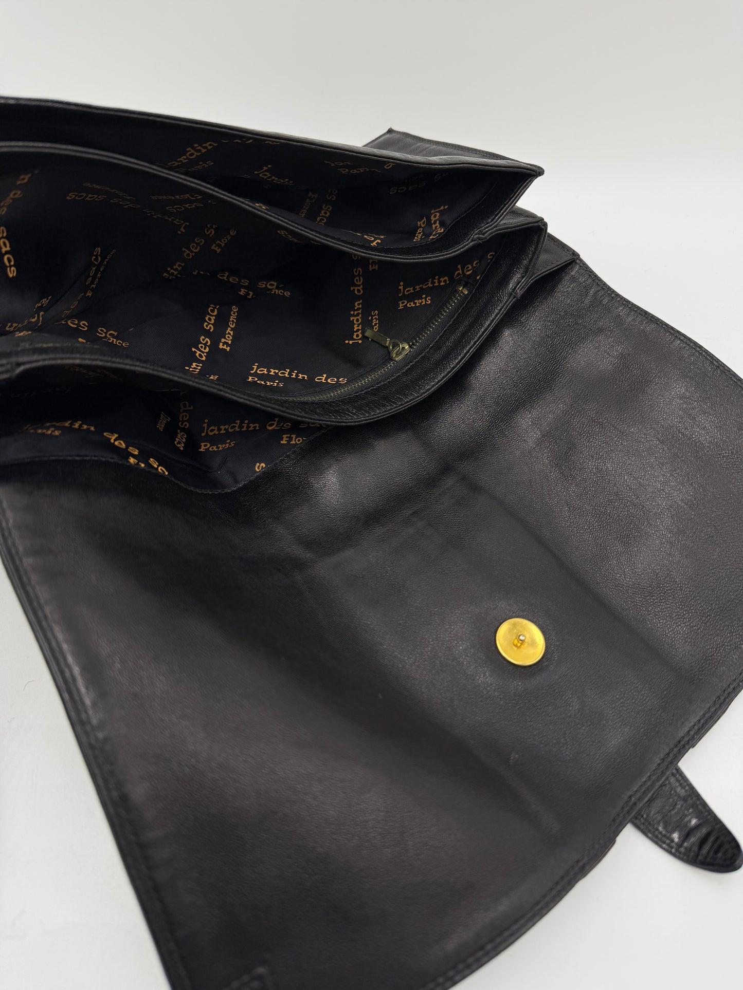 Clutch in pelle nera Jardin des Sacs anni '80