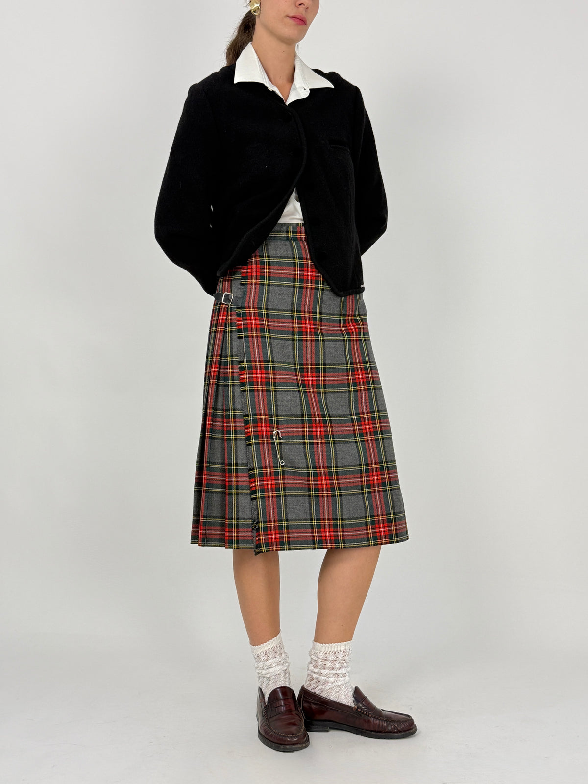 Dettaglio etichetta Ritzino hand pleated in Scotland 100% pure new wool Made in United Kingdom
