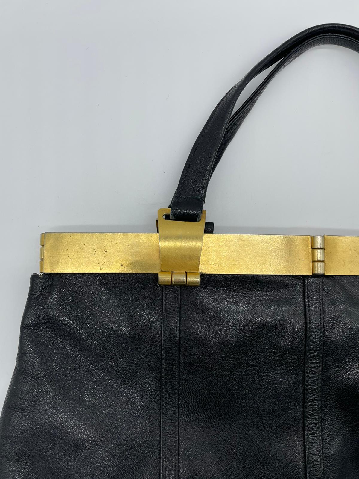 Nieri Argenti-Leather bag and gold plate